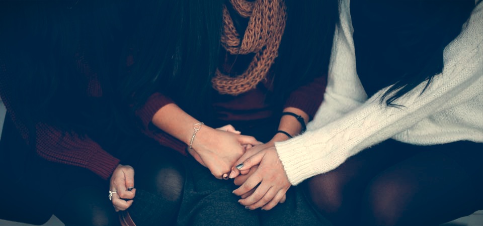 Three women praying